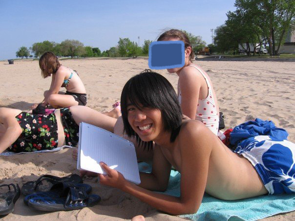 Marina lounging on a sunny beach with friends.