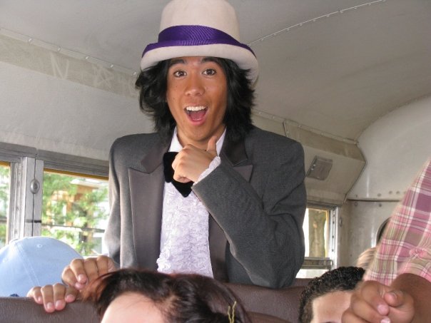 Marina in costume as Willy Wonka, on a bus.