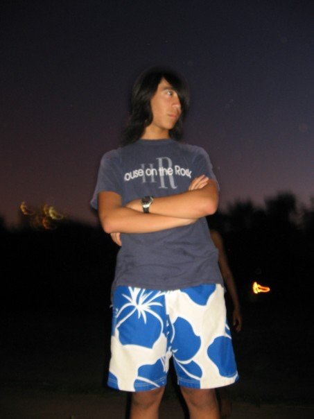 Teen Marina at the beach at night, looking off to the right